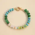 Detail of a colorful natural stone beaded bracelet with a shiny gold spring clasp. - Turquoise Green Mix (N4B945-8)