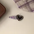 Detailed view of a cute purple heart hair clip with LOVE engraving and pink dots - Black Heart BB Clip