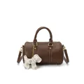 Elegant brown leather Boston pillow bag for women with a cute dog charm and shoulder strap - Brown with Pendant