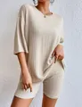 Close-up of beige ribbed knit two-piece lounge set with short sleeve top and shorts - S / Apricot