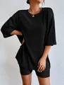 Women's chic black ribbed two-piece lounge set with oversized tee and biker shorts - Black