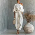 Detail view of a loose-fitting white cotton linen set with stylish lantern pants - S / One Shoulder Top Wide Leg Pants Outfits / Off White