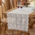 Elegant French lace table runner in white with floral patterns and pom-pom trim - Ilo White