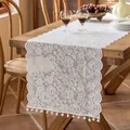 Elegant white French lace table runner with floral pattern and pom-pom ball trim - Roseline White