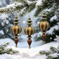 Bronze and gold glitter spindle Christmas ornaments hanging on a snowy pine tree branch. - Matte Dark Coffee