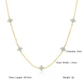 Macro view of 18K gold plated titanium steel clover necklace with zircon stones - Gold Necklace (N0458G)