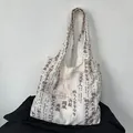 Vintage artistic canvas tote bag featuring classical Chinese calligraphy newspaper print - Classic Calligraphy