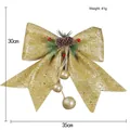 Large golden glitter Christmas bow with pinecones and berries tree ornament hanging - Gold