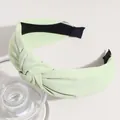 Fashionable mint green knotted wide-brimmed fabric headband for stylish daily wear. - Light Green
