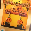 Festive Halloween themed pumpkin drop earrings featuring spooky orange jack-o'-lantern charms - Orange Jack-O-Lantern