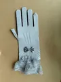 Elegant silver-grey bridal mesh gloves featuring a satin bow and delicate lace cuff - Gray