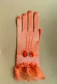 Elegant orange fishnet bridal gloves featuring a satin bow and lace trim detail - Orange