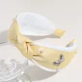 Elegant yellow satin knotted wide headband embellished with pearls and a silver butterfly. - Pearl Butterfly Decoration Style / Yellow