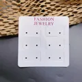Detailed view of white earring display card featuring Fashion Jewelry text and twelve holes - Pearly Style (7.2x7.2cm)