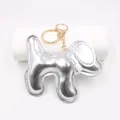 Portachiavi a forma di cane in ecopelle argento lucido con eleganti dettagli oro - Portachiavi Cane / Argento