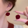 Elegant deep red velvet rose flower earrings with gold hoop closures for a vintage chic look - Single Red Rose Ear Buckle