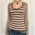 Casual women's brown and cream striped long-sleeve T-shirt with a stylish low scoop neck - XS / Brown and White