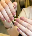 Elegant French press-on nails with nude pink base and soft yellow tips in oval shape - Medium-Length Oval Light Yellow French (CW1007)