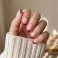 Elegant red French tip press-on nails with a natural nude base for a chic, classic look. - Medium-Length Square-Round Red French (CW1008)