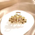 Elegant butterfly hair claw clip with champagne rhinestones on a gold metal frame - Butterfly Design / Champagne