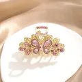 Elegante mittlere Schmetterling-Haarklammer mit rosa Strasssteinen in Gold-Finish-Optik - Schmetterlings-Design / Rosa