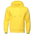 Close-up of plain yellow hooded pullover hoodie with kangaroo pocket and fleece texture. - Yellow