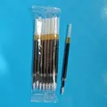 Close-up detail of black ink ballpoint pen refills in transparent plastic packaging - 10 Refills Pack / Black