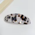 Elegant acetate oval hair clip with minimalist black and white marbled pattern - Rock Brown