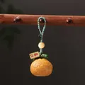 Realistic persimmon fruit keychain with Good Luck tag and green braided cord - Bocote Dreams Come True Orange