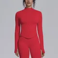 Detailed view of women's red seamless zip-up yoga top and matching high-waisted leggings - Red