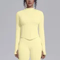 Seamless pale yellow yoga jacket with stand collar, full zipper, and thumb holes - Creamy Yellow