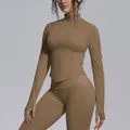 Close-up detail of a seamless high-elasticity zip-up yoga jacket with thumb holes for women - Dark Coffee