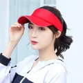 Asian model wearing a vibrant red sun visor hat for sports and outdoor sun protection - Adjustable / Plain Solid Red Sun Visor
