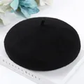 Close-up of black wool beret hat showing high-quality wool felt texture and classic style. - One Size / Black