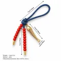 Ciondolo per borsa stile etnico con perle rosse, lisca di pesce d'oro e cordoncino blu - Stile Pesciolino Perla Rossa (XCBS261215R)