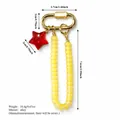 Ciondolo per borsa retrò con stella rossa e catena di perle gialle in lega dorata - Stile Stella (XCBS261215R)