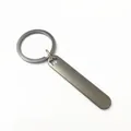 Matte gunmetal metal keychain with star cutout detail, ideal for custom engraving. - Black Star-Shaped Cutout