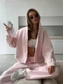 Stylish pink oversized hoodie and jogger tracksuit set for women in casual street style - S / Pink