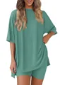 Detail view of women's loose two-piece ribbed pajama set in teal color - XS / Lake Green