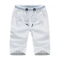 Classic white casual men's summer shorts featuring drawstring waist and striped interior - M / White