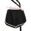 High waisted black yoga shorts for women featuring stylish contrast white piping detail - Black