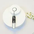 Detail of a 5ml mini rhinestone-encrusted perfume bottle keychain with a silver finish. - Dark Colored Rhinestone Style (C2)