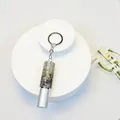 Close-up of a 5ml mini rhinestone perfume spray bottle with a silver keychain accessory. - Silver Colorful Rhinestone Style (C1)