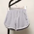 Comfortable grey loose yoga shorts with white contrast trim and elastic waist for women - Light Gray