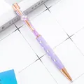 Elegant purple crystal ballpoint pen featuring clover charm and rose gold finish accents - 1.0mm Bullet Tip / Engraved Candy Purple