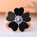 Detailed macro view of a rose flower scarf ring with black heart petals and center gem - Rose Gold Heart-Shaped Flower (DY0011)
