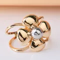 Detailed view of a metallic gold flower-shaped scarf and belt buckle with a silver center. - Two-Tone 3D Flower (DY0012)