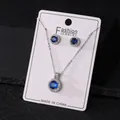 Elegant versilbertes Halsketten- und Ohrring-Set mit runden blauen Zirkon-Akzenten - Blau