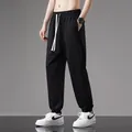Black men's thin cotton joggers with elastic waist and drawstring detail - S / Black