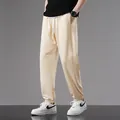 Men's lightweight cream cotton joggers featuring drawstring waist and ribbed cuffs - S / Off-white
